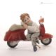 NININ - Porcellana Capodimonte, figura in vespa, eleganza italiana.